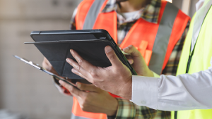 Contractors looking at a tablet